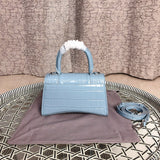 Styled lifestyle shot of structured polished women's handbag – women's designer-style accessory