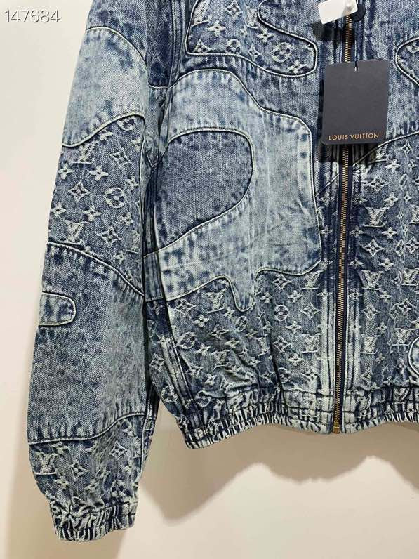Flat lay presentation of Louis Vuitton luxury clothing with signature branding