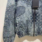 Flat lay presentation of Louis Vuitton luxury clothing with signature branding