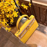 Side view of minimalist structured handbag