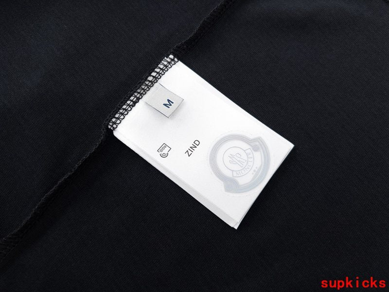 Side profile of Moncler luxury clothing with logo-detail design