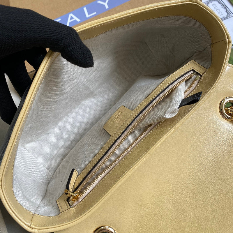 Side profile of modern polished women's handbag – women's statement bag