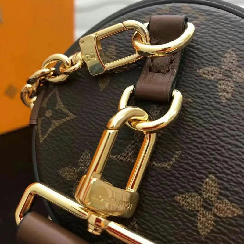 Handle and strap detail of polished structured women's handbag – women's everyday handbag