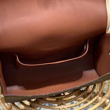 Side profile of modern refined women's handbag – women's luxury accessory
