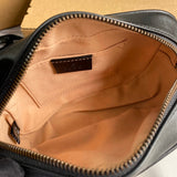 Close-up detail of structured signature women's handbag – women's statement bag