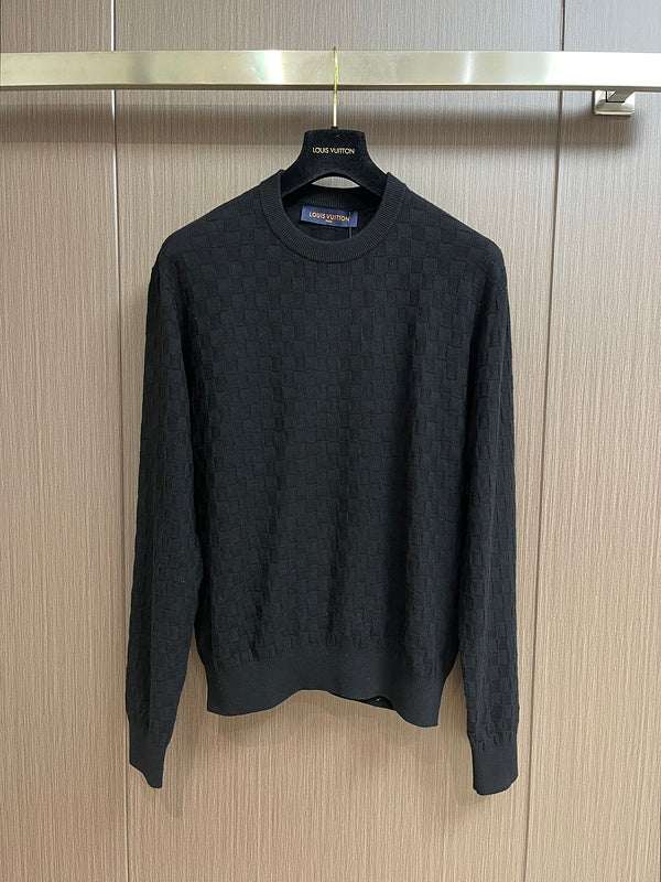 Back view of Louis Vuitton luxury clothing with label-forward styling