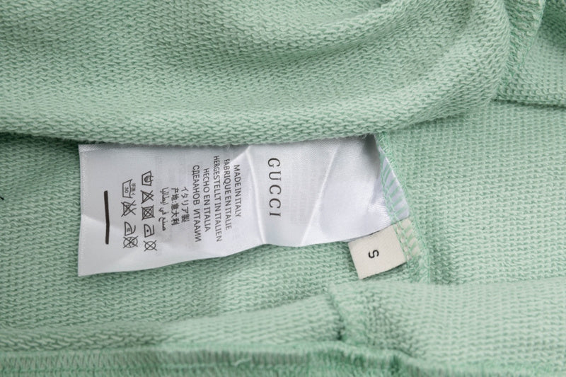 Close-up detail shot of Gucci luxury clothing with tailored silhouette