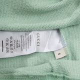 Close-up detail shot of Gucci luxury clothing with tailored silhouette