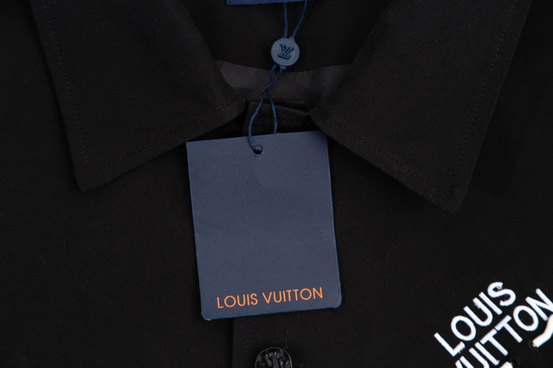 Flat lay presentation of Louis Vuitton luxury clothing with monogram-inspired silhouette