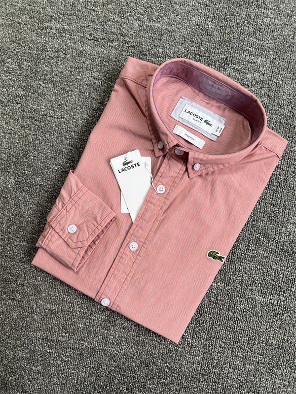 Close-up detail shot of Lacoste luxury clothing with monogram-inspired silhouette