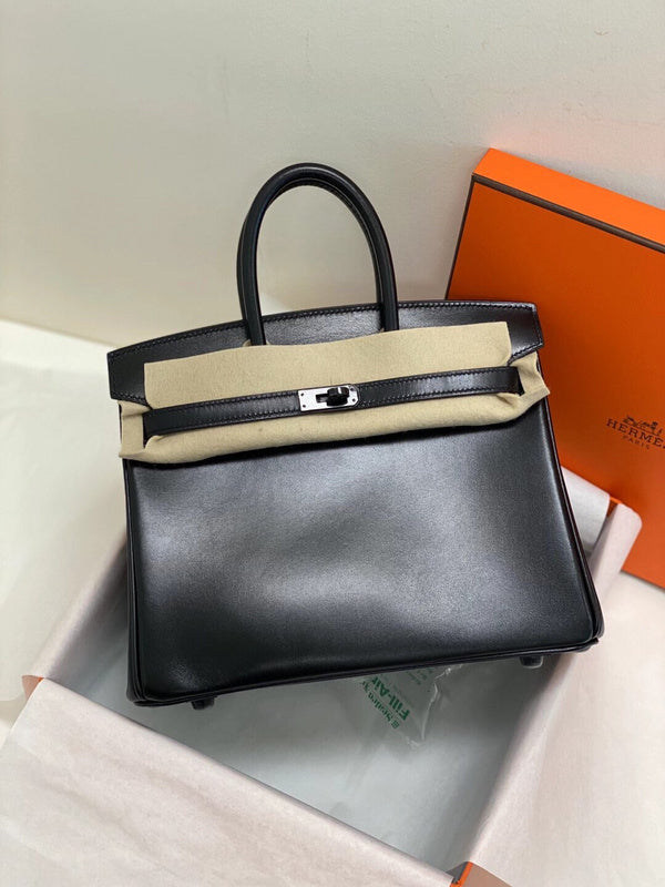 Side view of streamlined structured handbag