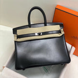 Side view of streamlined structured handbag