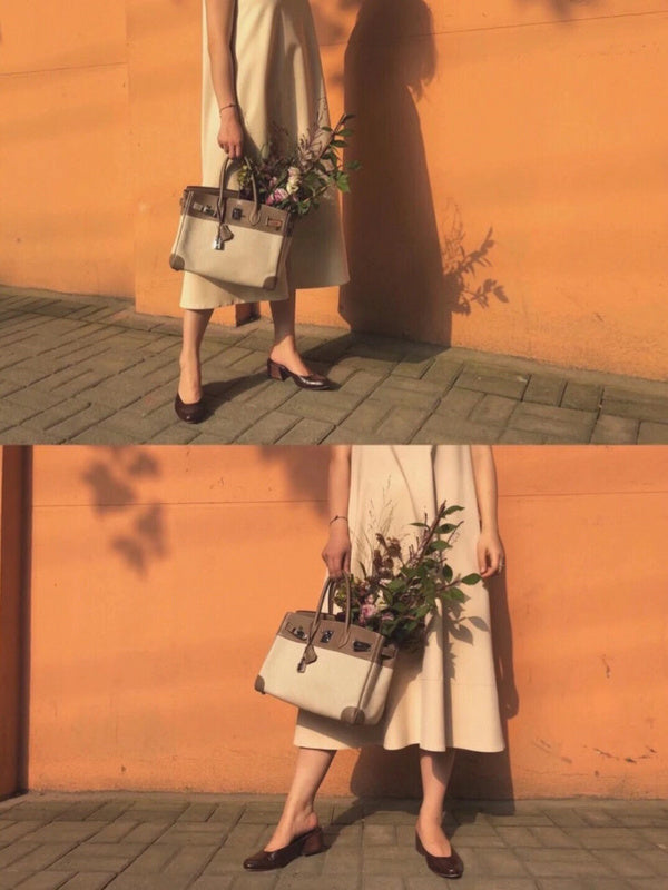 Side view of sleek structured handbag