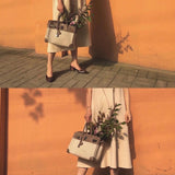 Side view of sleek structured handbag