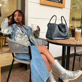  Signature everyday bag carried on shoulder