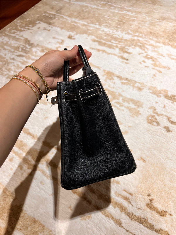 Side view of classic structured handbag