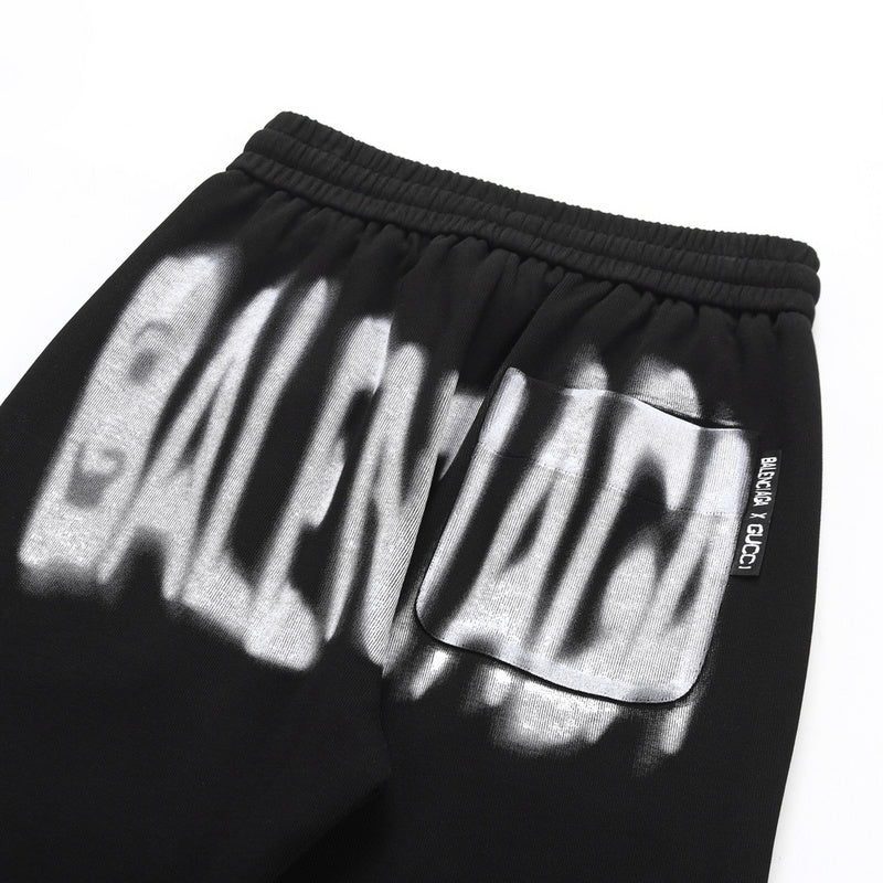 Close-up detail shot of Gucci luxury clothing with monogram-inspired silhouette