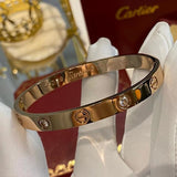 Side view of Cartier unisex jewelry piece