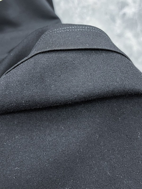 Back view of Louis Vuitton luxury clothing with everyday silhouette