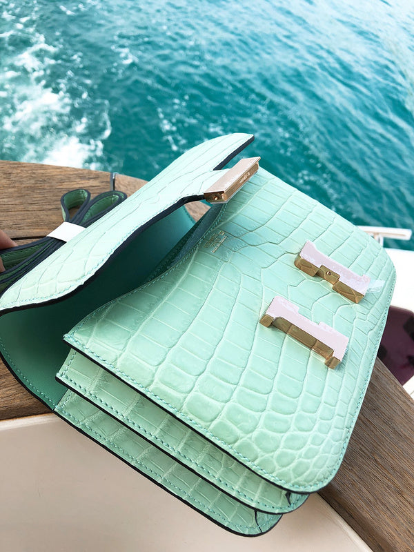 Side view of fluid structured handbag