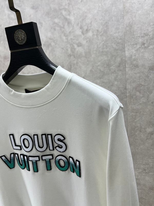 Full styled look of Louis Vuitton luxury clothing with monogram-inspired silhouette