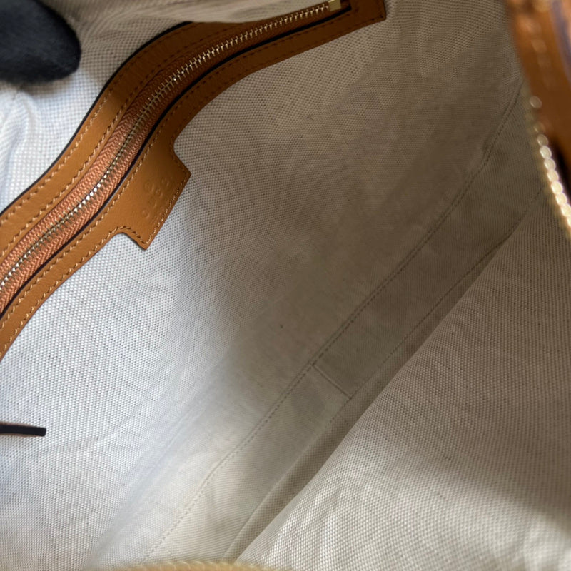 Close-up detail of signature statement women's handbag – women's premium purse