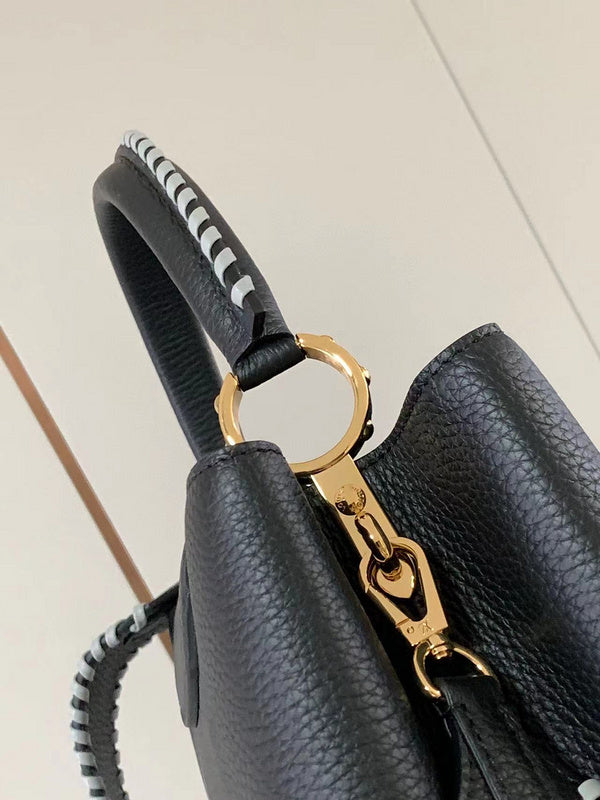 Handle and strap detail of everyday-luxe signature women's handbag – women's luxury handbag
