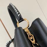 Handle and strap detail of everyday-luxe signature women's handbag – women's luxury handbag
