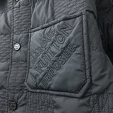 Full styled look of Louis Vuitton luxury clothing with label-forward styling