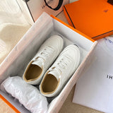 Hermès White Chunky Platform Sneakers - Close-Up Texture View