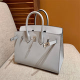 Side view of poised structured handbag