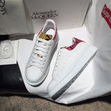 Alexander McQueen fresh white-and-black luxury sneakers view 10 signature lace-up style