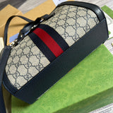 Styled lifestyle shot of sleek refined women's handbag – women's luxury accessory