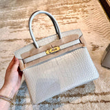  Signature everyday bag carried on shoulder