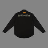 Close-up detail shot of Louis Vuitton luxury clothing with logo-detail design
