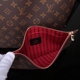 Styled lifestyle shot of everyday-luxe sleek women's handbag – women's luxury accessory
