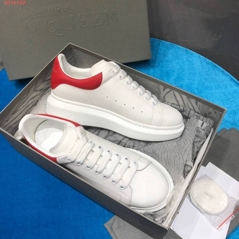 Side profile of Alexander McQueen neutral cream sneakers minimalist modern build