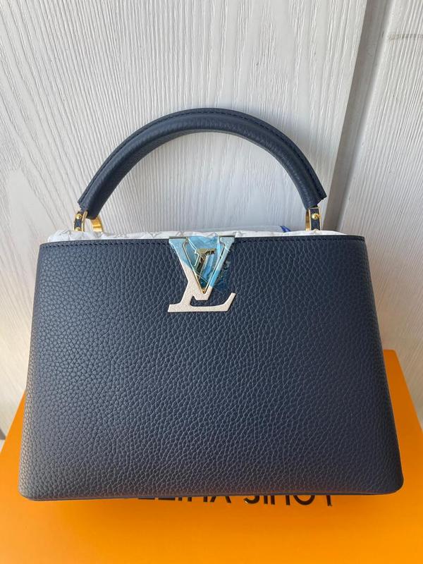 Styled lifestyle shot of premium refined women's handbag – women's luxury handbag