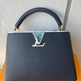 Styled lifestyle shot of premium refined women's handbag – women's luxury handbag