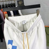 Side profile of Rhude luxury clothing with logo-detail design
