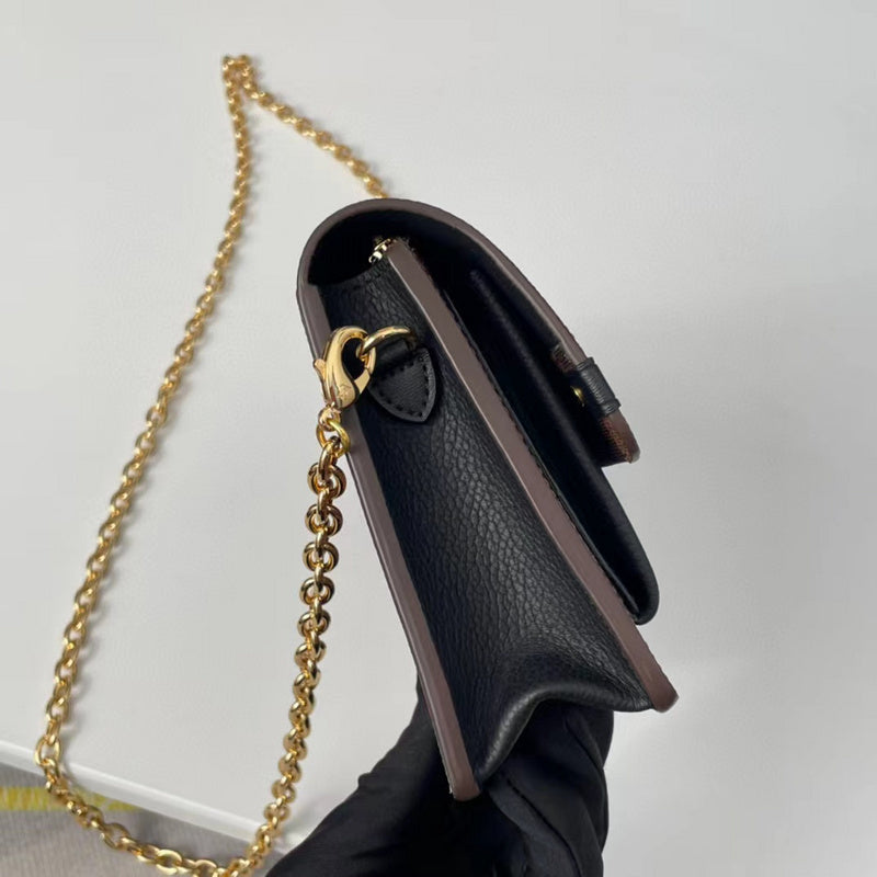 Back view of sleek chic women's handbag – women's statement bag