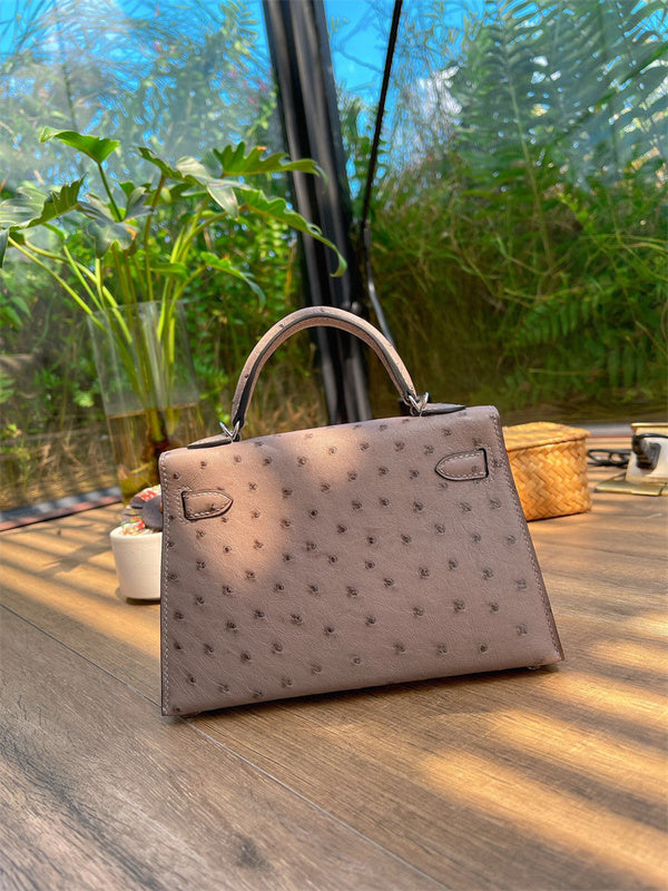  Elegant top-handle bag carried on shoulder