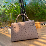  Elegant top-handle bag carried on shoulder