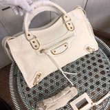 Side profile of polished premium women's handbag – women's statement bag