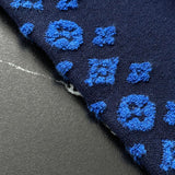 Flat lay presentation of Louis Vuitton luxury clothing with contemporary cut