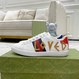 Gucci Designer sneakers in fresh white-and-black breathable knit upper front view