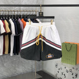 Close-up detail shot of Rhude luxury clothing with label-forward styling