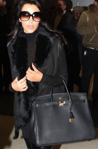 Side view of refined structured handbag