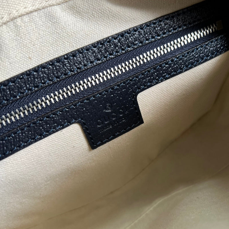 Side view of sophisticated structured handbag