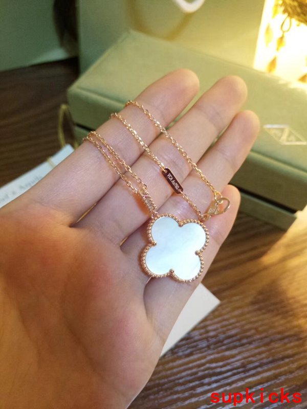 Lifestyle view of Van Cleef & Arpels unisex jewelry piece